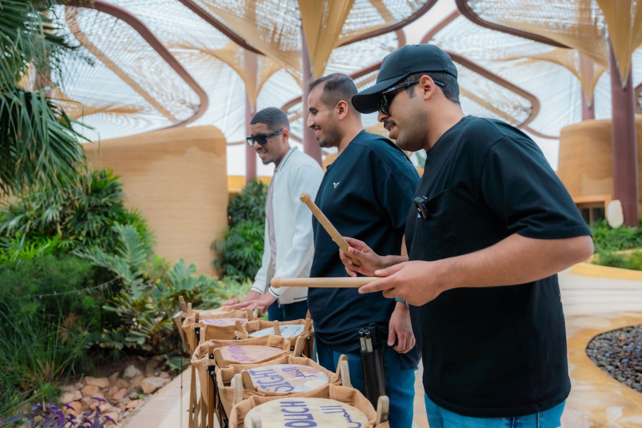 Mohammed, Mansour, and Abdulaziz performing The Six Drums, a symbolic welcome ritual at Six Senses Southern Dunes